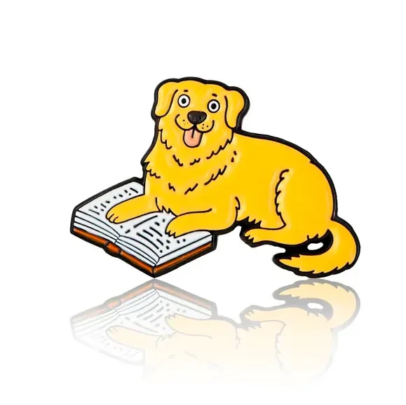 Pin labrador z książką.webp